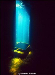 A blade of sunlight on the hatchway in the wreck of " Min... by Alberto Romeo 